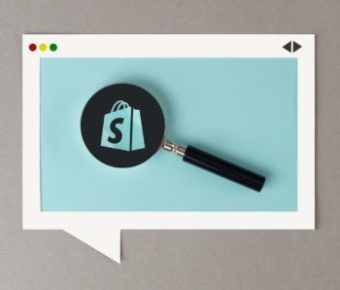 shopify logo in a looking glass on a browser window, illustrating shopify collection seo optimizations